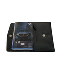 2023 BMW XM Owner Manual Car Glovebox Book - product image of an owner manual book and protective black document pouch