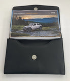2023 Jeep Wrangler Owner Manual Car Glovebox Book - product image of an owner manual book and protective black document pouch